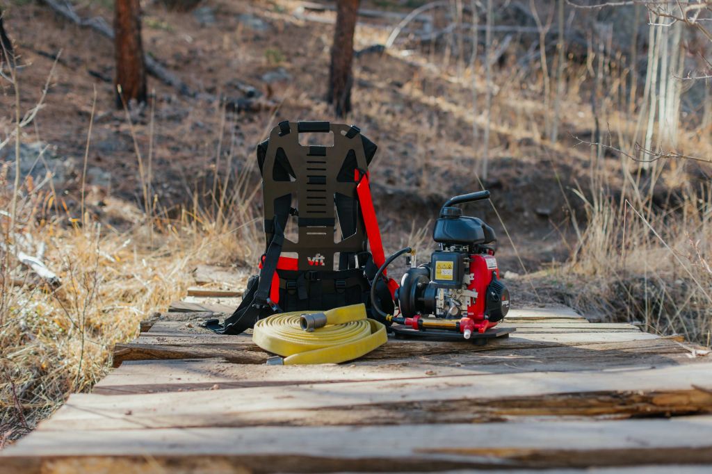 Wildland firefighter operating Vallfirest North America equipment in the field